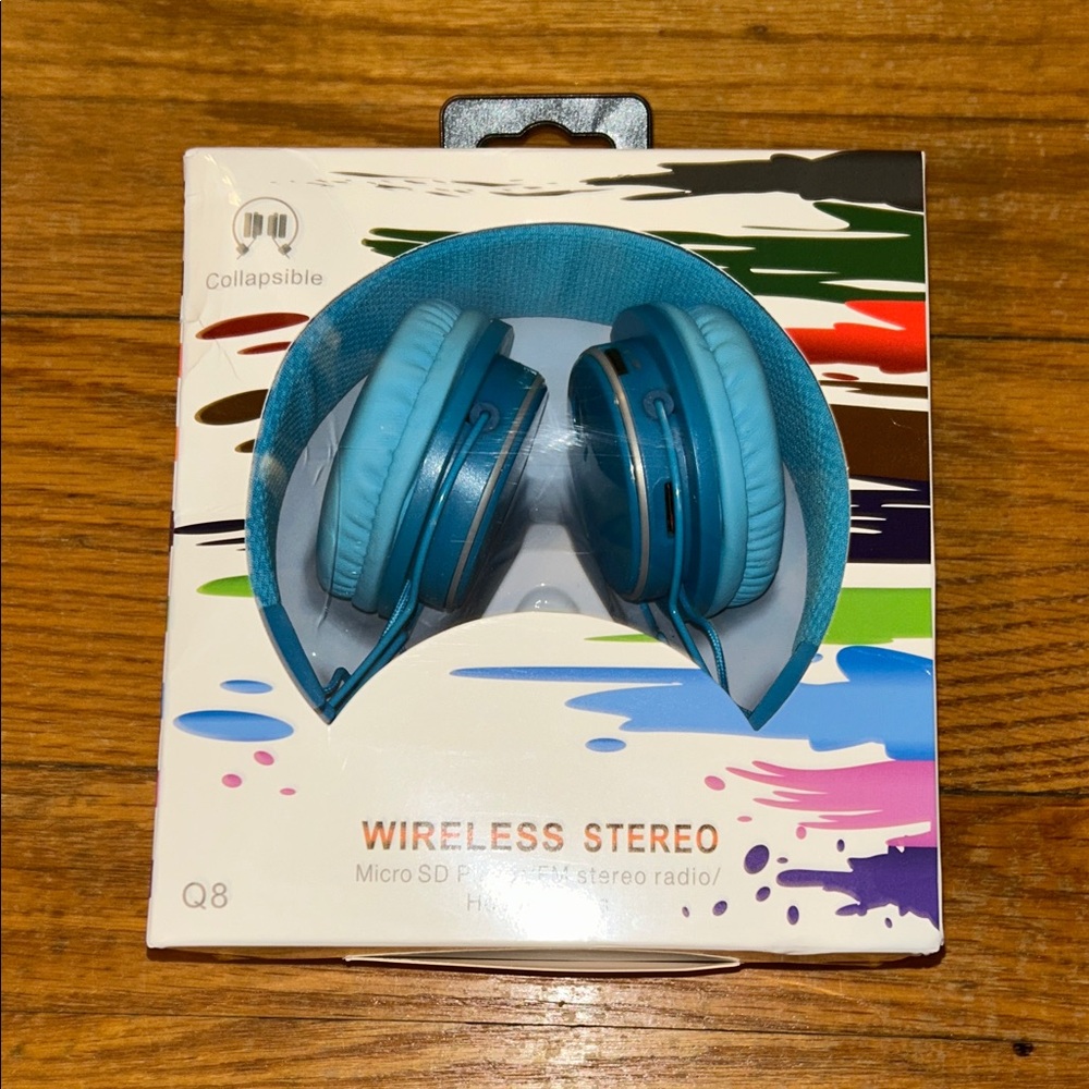 New in box. Blue Wireless Stereo Headphones
